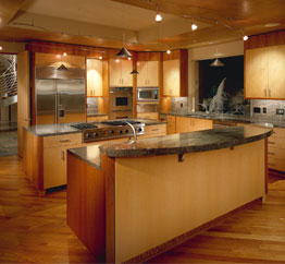 This kitchen in Scottsdale (Fairway I) is open to an adjacent family room and breakfast nook, and with a large window at the sink that slides into pocket to create an indoor/outdoor effect. 